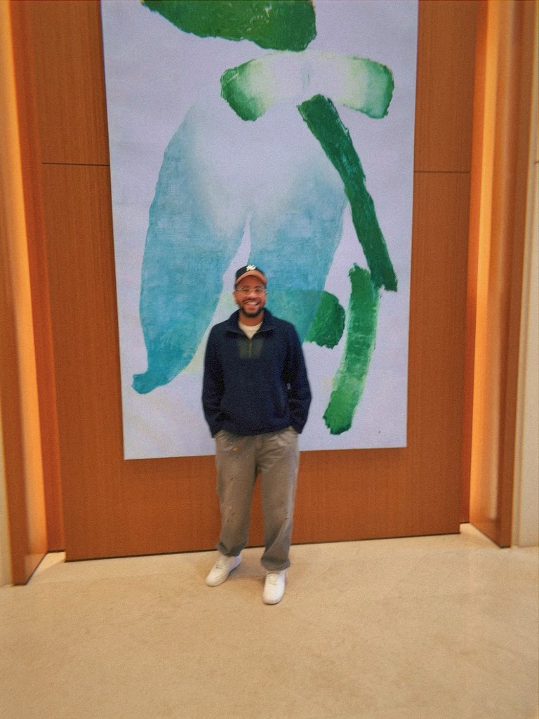 Chris Paris standing in front of a painting, circa 2025