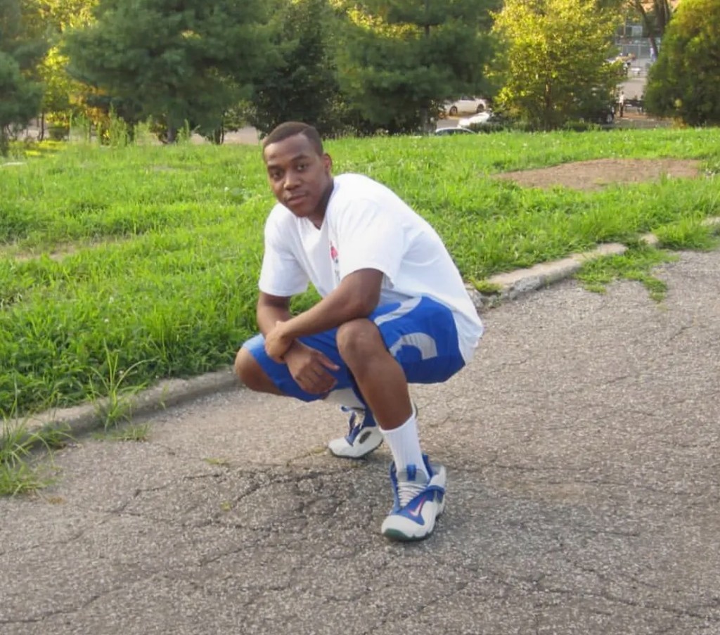 Chris Paris crouching outdoors, circa 2016